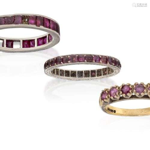 Two ruby eternity rings and a ruby half-hoop ring, one etern...