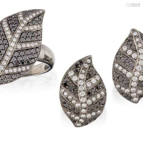 A diamond and black diamond ring and pair of earrings, of ma...
