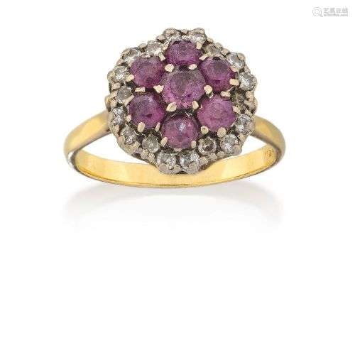 A ruby and diamond cluster ring, the circular ruby seven sto...