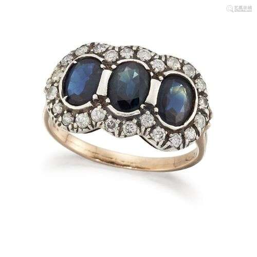A sapphire and diamond ring, of triple cluster design, compo...