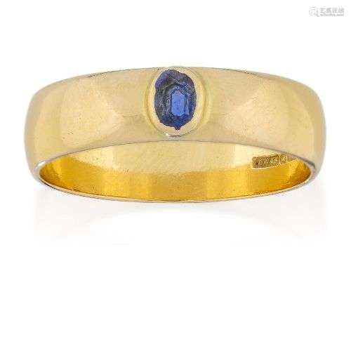 An 18ct gold and sapphire ring, the collet set oval sapphire...