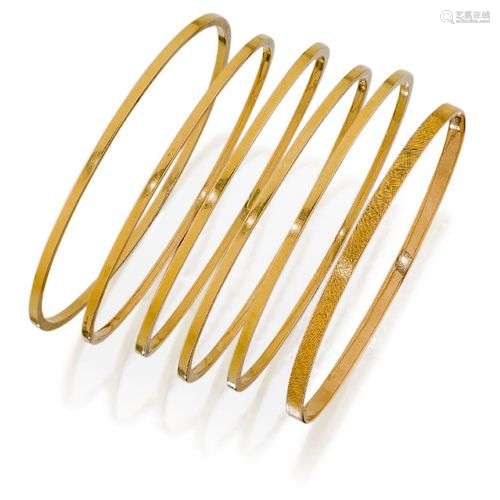 A group of six early 20th century gold bangles, including fi...
