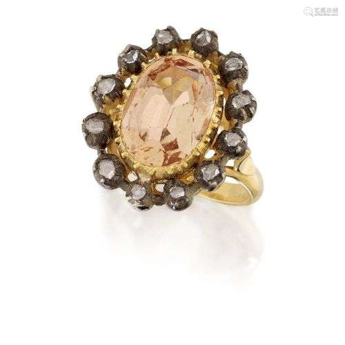An Imperial topaz and diamond cluster ring, the oval mixed-c...