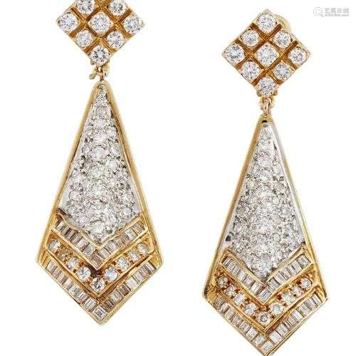 A pair of diamond pendant earrings, the brilliant, baguette ...