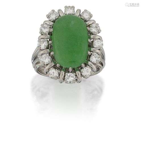 A jadeite jade and diamond ring, the single cabochon jade in...