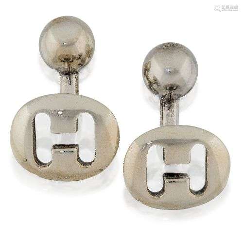 A pair of silver cufflinks, by Hermes, designed as oval loze...