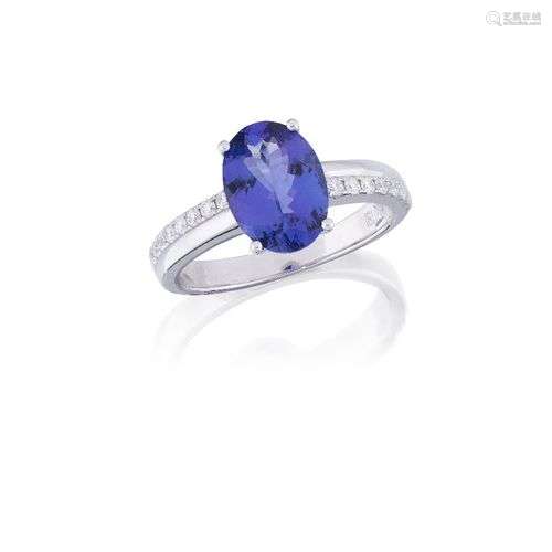 A tanzanite and diamond ring, the oval tanzanite, weighing a...