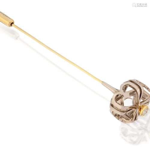 A diamond-set stick pin, modelled as an openwork crown with ...