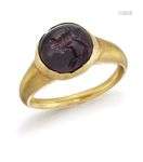 A Sassanian gold and garnet finger ring, the cabochon garnet...