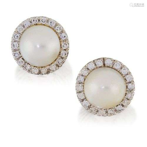A pair of cultured pearl and diamond earrings, each set with...