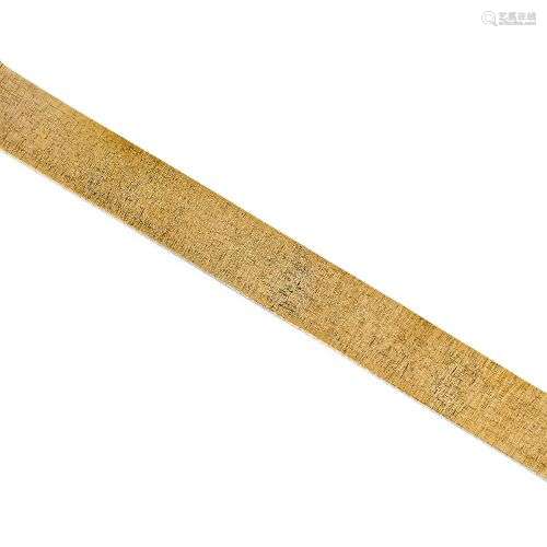 A 9ct gold textured bracelet, of flexible brick link design,...