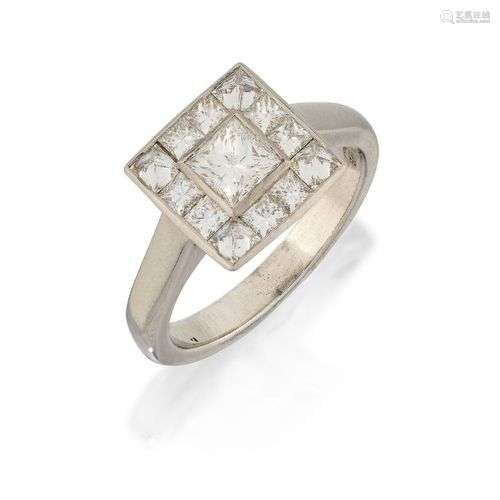 A diamond cluster ring, the princess-cut diamond centre with...