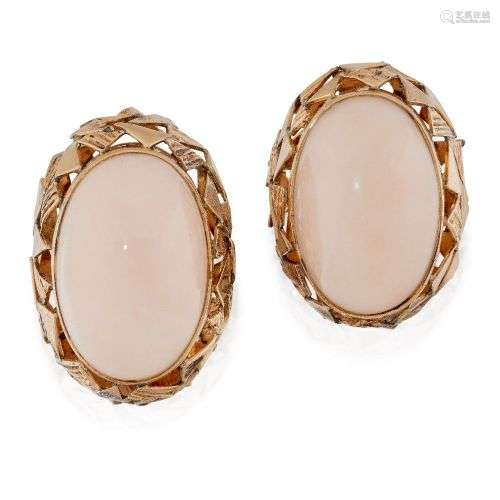 A pair of coral earclips, each oval cabochon coral, coralliu...