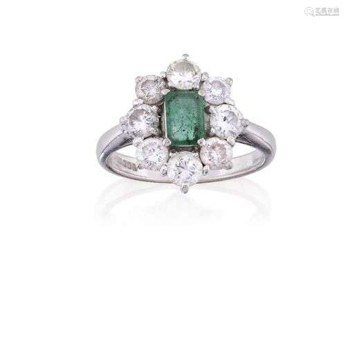 An 18ct gold, emerald and diamond cluster ring, the rectangu...