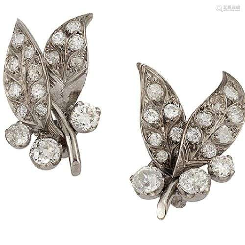 A pair of diamond earrings, of bud and twin leaf design set ...