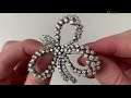 An 18k white gold diamond brooch