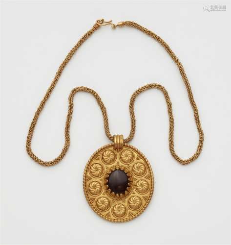 A 22k gold amulet necklace