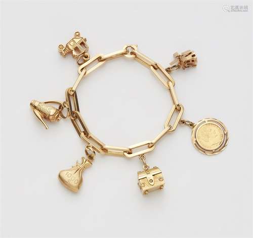 An 18k gold charm bracelet