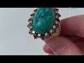 An 18k gold ruby and turquoise cabochon ring