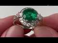 An 18k white gold emerald cluster ring