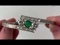 A 14k gold emerald and diamond bangle