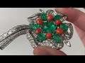 A retro style platinum emerald diamond coral clip brooch