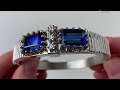 A 14k white gold tanzanite bangle