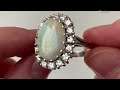 An 18k white gold opal cluster ring