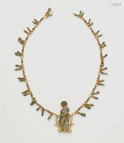 A 22k gold necklace with an ancient Roman relief fragment