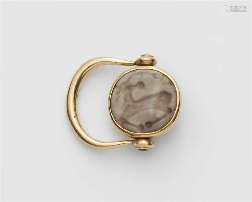 An 18k gold swivel ring with an ancient intaglio
