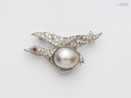 A miniature pearl brooch