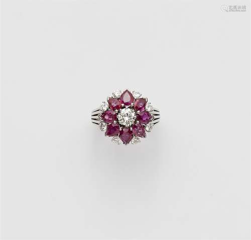 An 18k white gold ruby flower ring