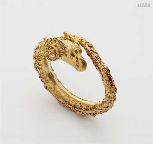 A 18k gold Etruscan style bangle