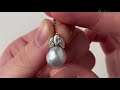 An 18k white gold pearl and diamond demi-parure