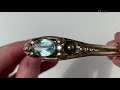 A 14k gold aquamarine bangle