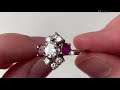 An 18k white gold diamond and ruby ring