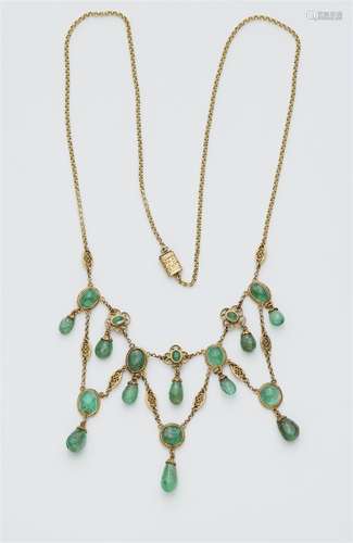 An 18k gold emerald necklace