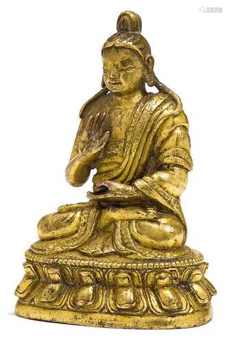 A GILT BRONZE MINIATURE FIGURE.