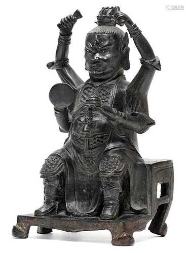 A BRONZE FIGURE OF A FOUR-ARMED HEAVENLY GENERAL.