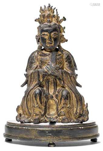 A BRONZE FIGURE OF THE SEATED XIWANGMU.