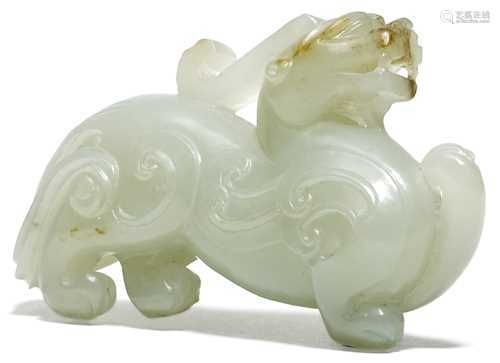 A PALE CELADON JADE CARVING OF A MYTHICAL BEAST.