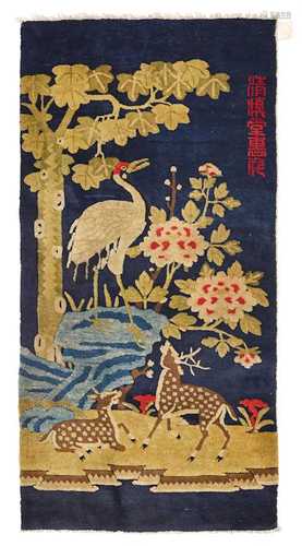 A BAOTOU CARPET DECORATED WITH TWO DEER AND A CRANE.