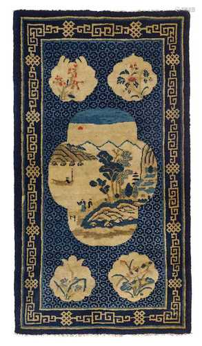 A BAOTOU CARPET WITH A LANDSCAPE CARTOUCHE.