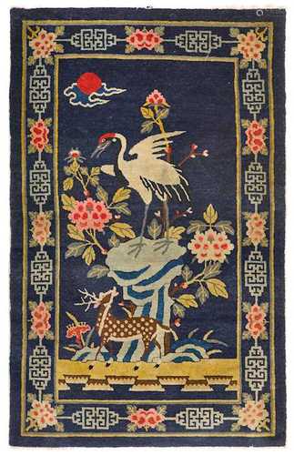 A BAOTOU CARPET WITH DEER AND CRANE IN A GARDEN LANDSCAPE.