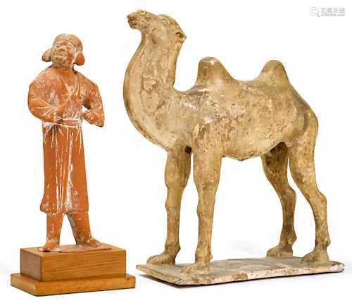 A POTTERY CAMEL WITH GROOM.