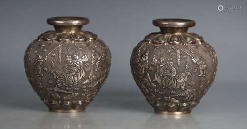 PAIR OF SILVER CAST CHILD PATTERN JARS