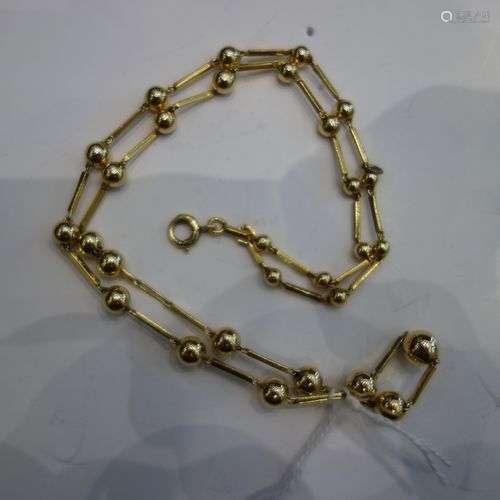 Chaîne en or jaune 18K (750‰) alternée de boules. …