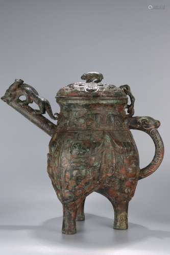 chinese bronze wine vessel with beast-mask design