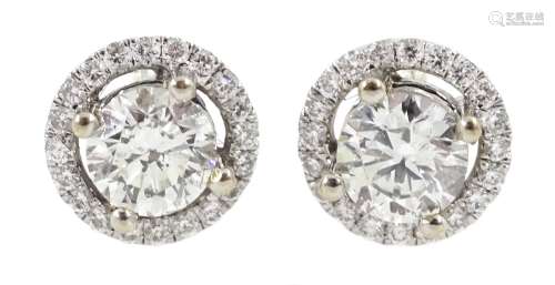 Pair of 18ct white gold round brilliant cut diamond halo stu...