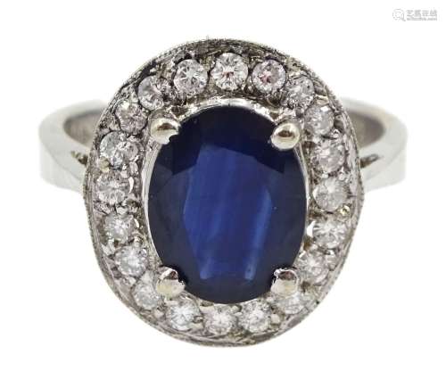 White gold oval sapphire and diamond cluster ring